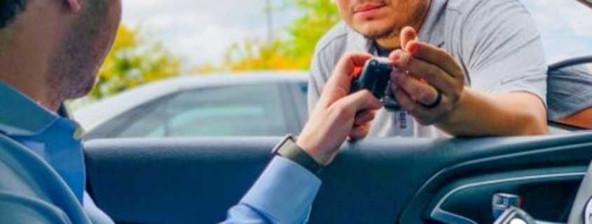 a man holding a phone and another man holding a cell phone