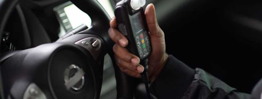 Client gets ready to blow into Smart Start Ignition Interlock Device