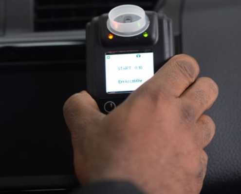 Driver reaching for Smart Start Ignition Interlock Device
