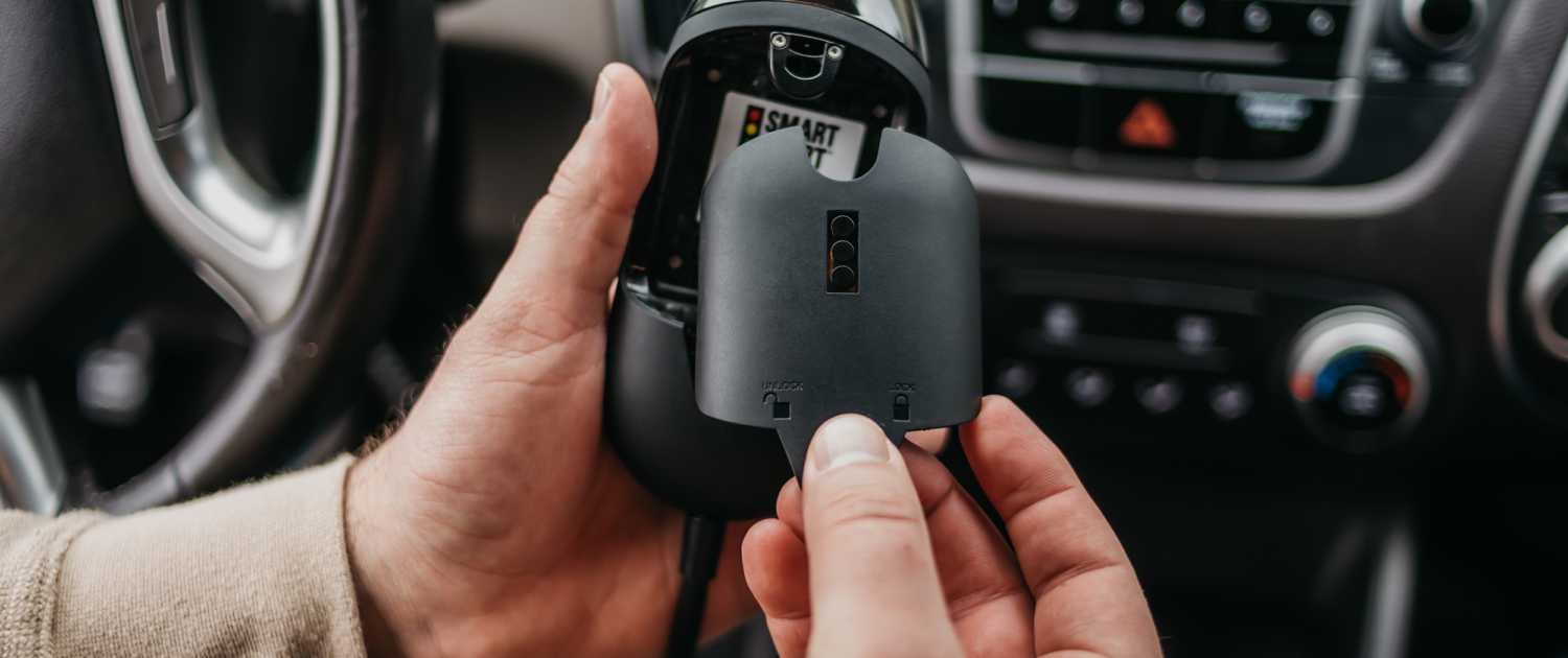a person replacing the fuel cell module of a Smart Start FLEX™ Ignition Interlock in a car