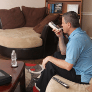 a man sitting on a couch playing video games